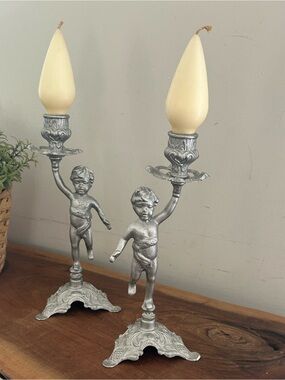 Vintage Metal cherubs Candleholders holding candlestick’s silver / bronze